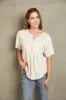 Buttoned Notched Neck Short Sleeve Top sold by The Dogwood Boutique