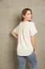 Buttoned Notched Neck Short Sleeve Top sold by The Dogwood Boutique