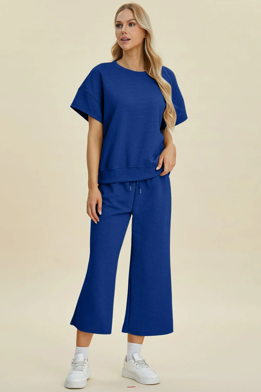 Full Size Texture Round Neck Short Sleeve Top and Wide Leg Pants Set sold by The Dogwood Boutique