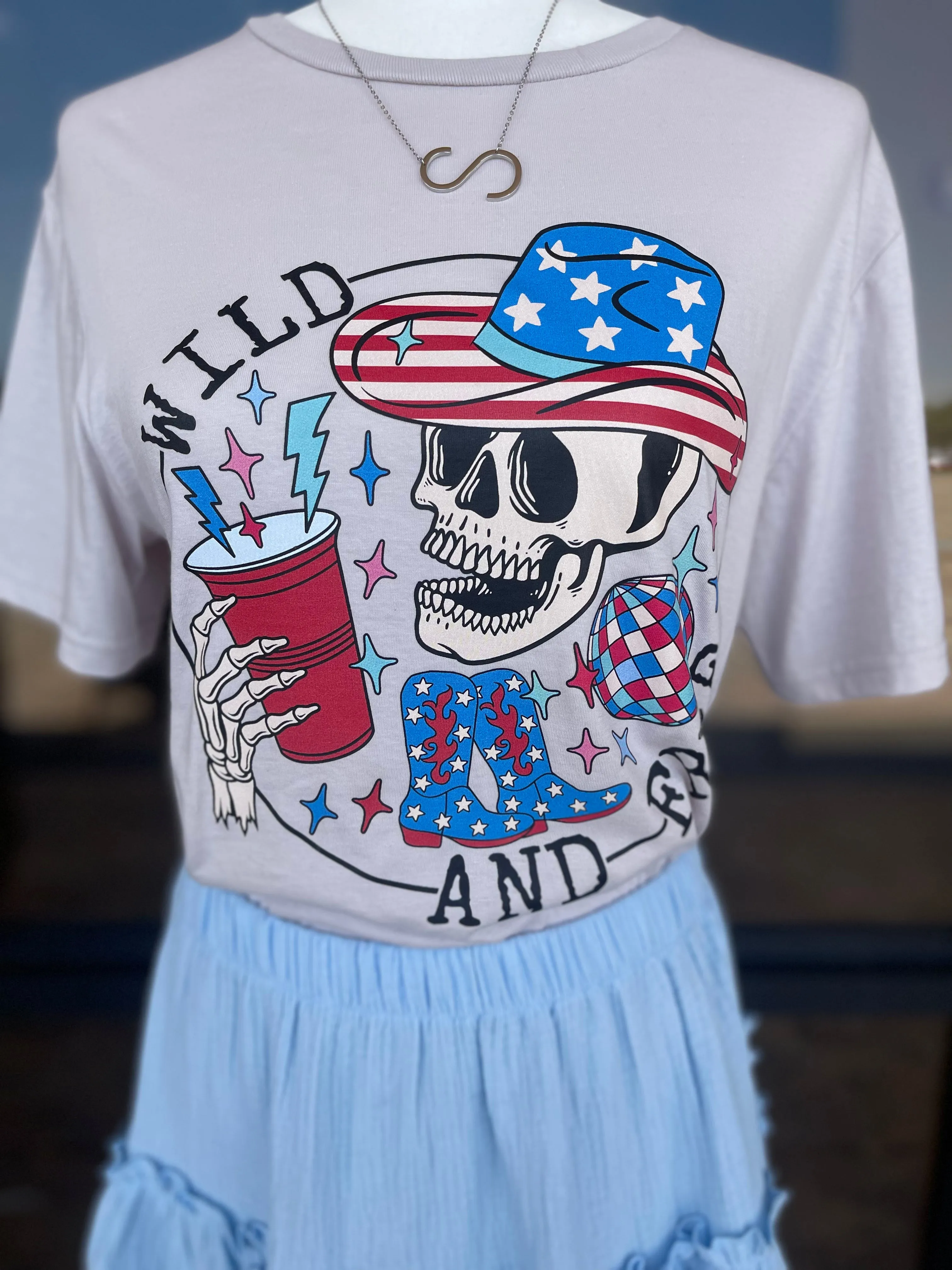 Wild & Free Patriotic Skelly Tee Shirt sold by The Dogwood Boutique