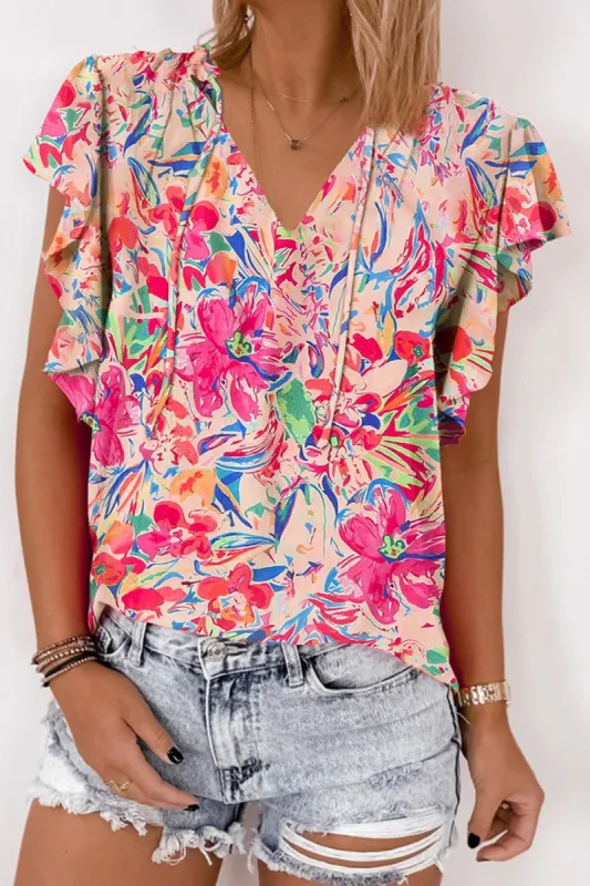Ruffled Printed Tie Neck Cap Sleeve Blouse sold by The Dogwood Boutique