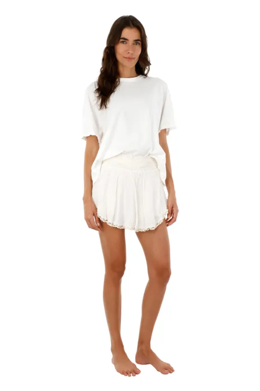 White Gaudy Skort sold by Malai Swimwear