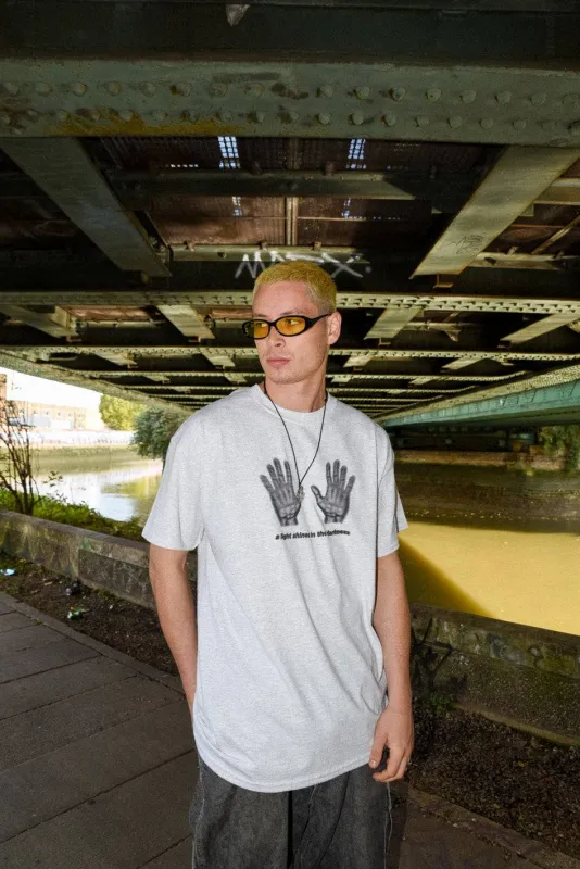 T-Shirt in Ash Grey with A Light Shines In The Darkness Print sold by Dream But Do Not Sleep