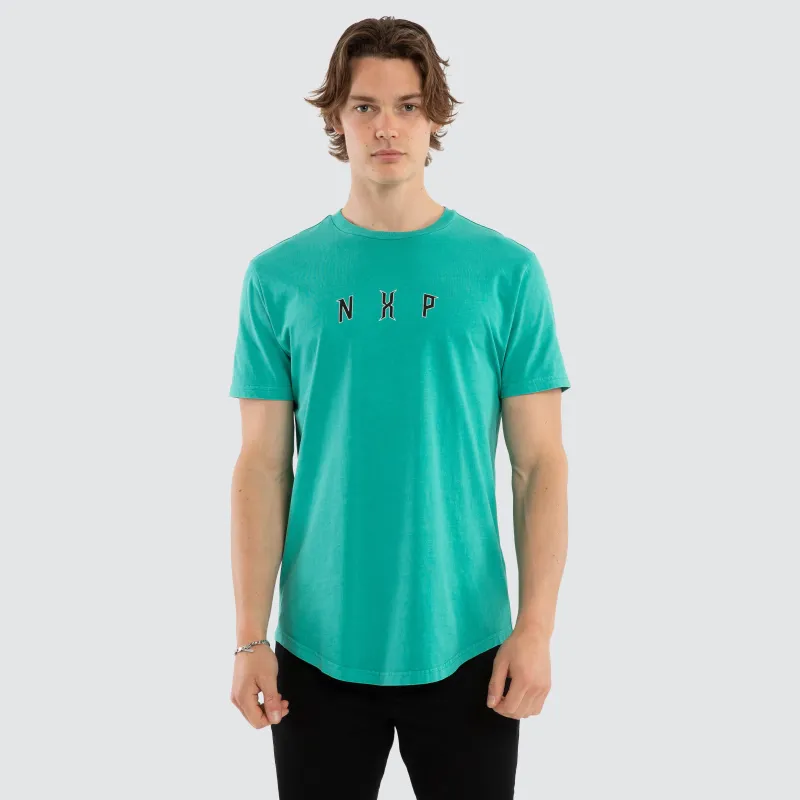 Dominate Dual Curved Tee Pigment Arcadia sold by Nena and Pasadena