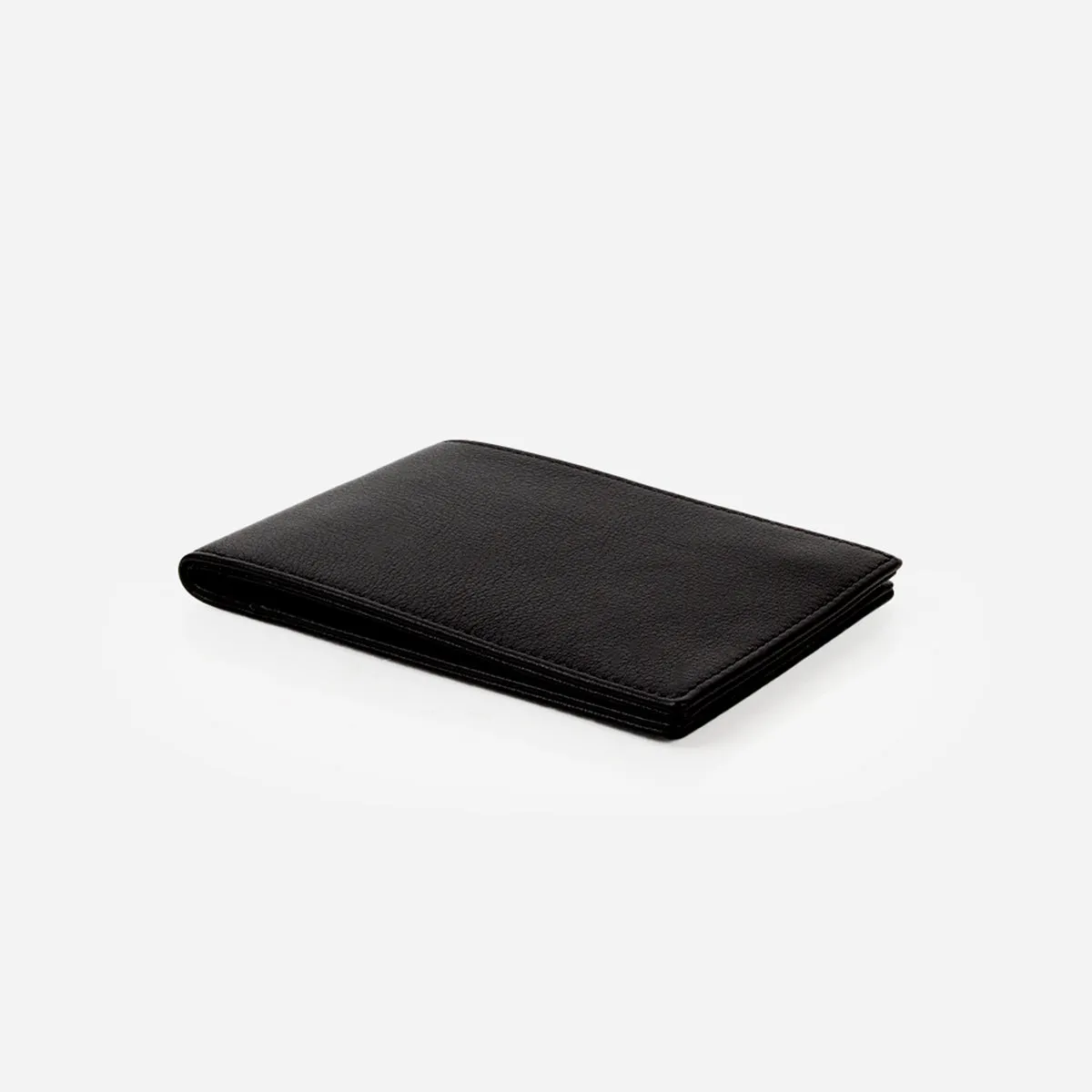 The Slim Passport Holder Black sold by Poppy Barley