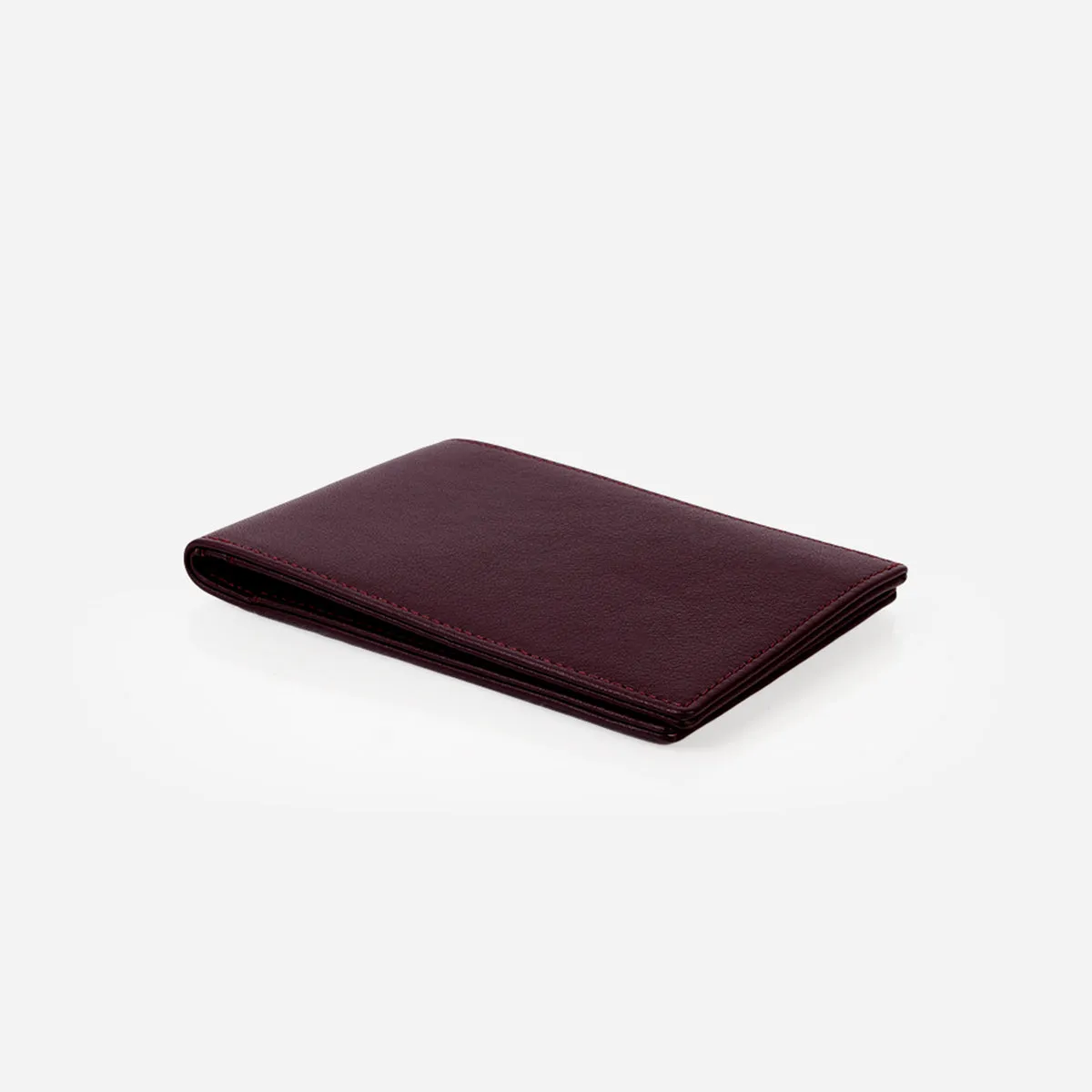 The Slim Passport Holder Aubergine sold by Poppy Barley