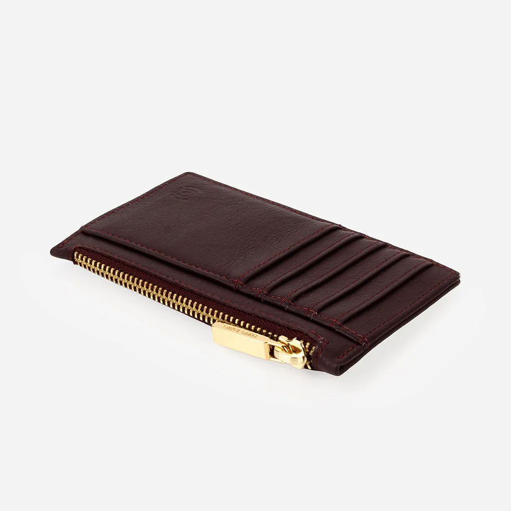 The Zip It Cardholder Aubergine sold by Poppy Barley