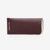 The Sunglasses Sleeve Aubergine sold by Poppy Barley