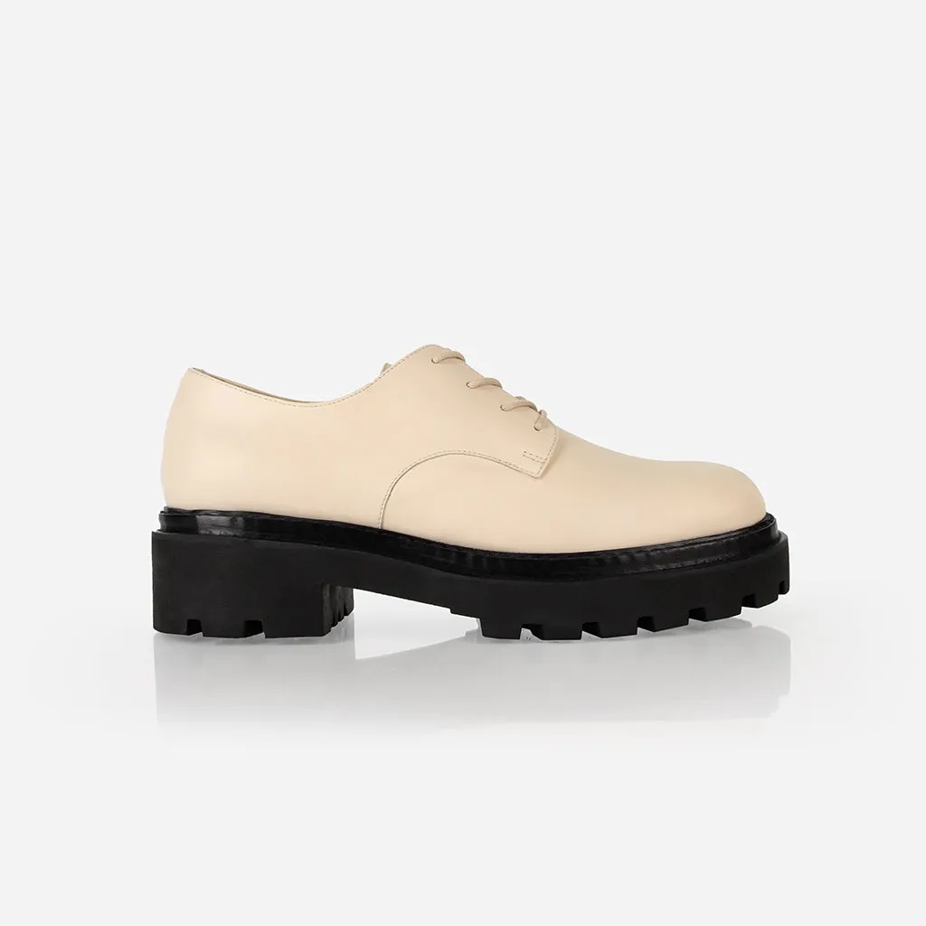The Uniform Oxford Creme sold by Poppy Barley