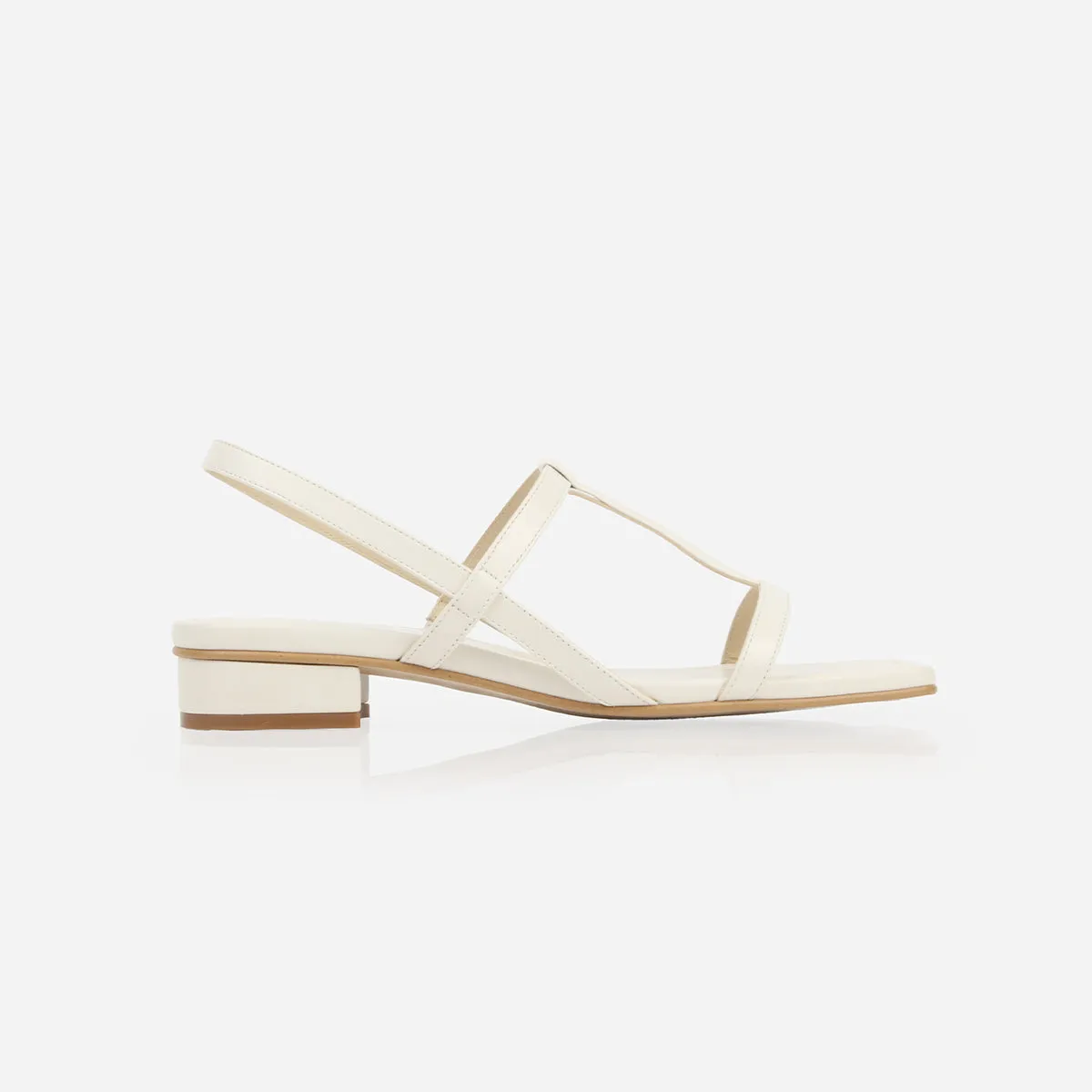 The Barely There Sandal Ivory sold by Poppy Barley