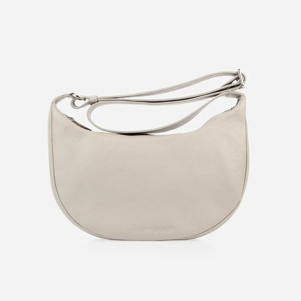 The Arc Crossbody Bag Stone sold by Poppy Barley