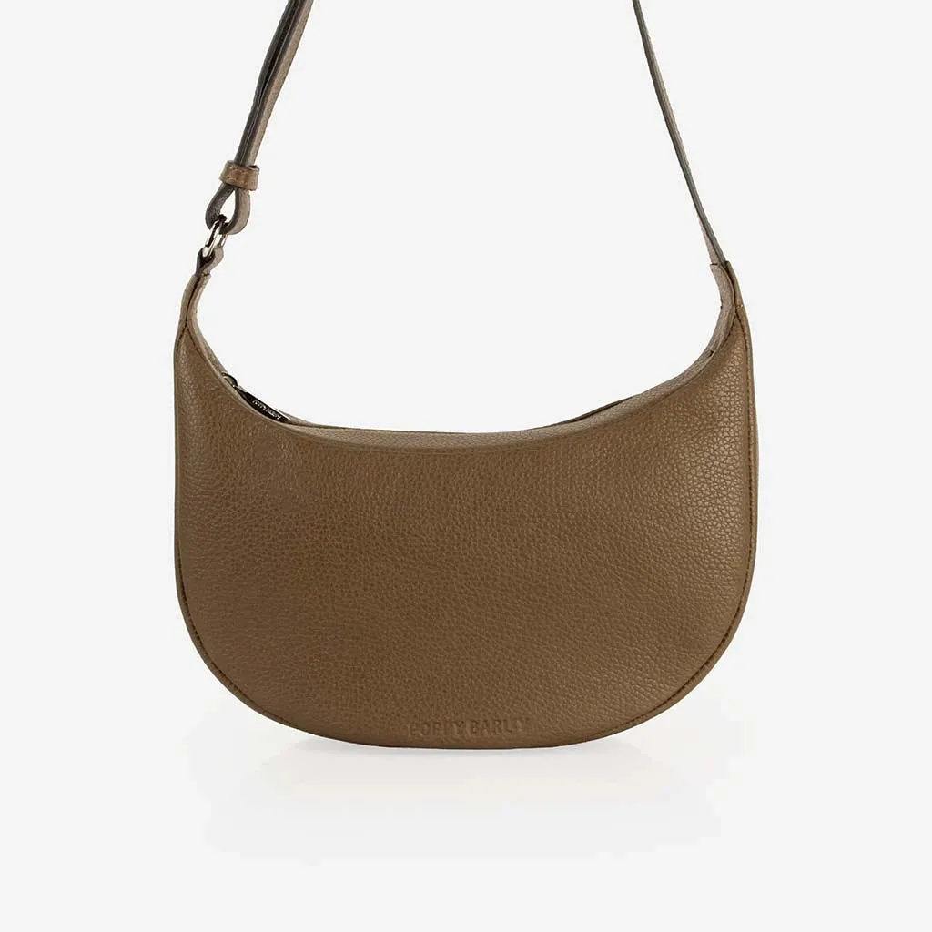 The Arc Crossbody Bag Tapenade sold by Poppy Barley