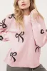 Bow Pattern Round Neck Loose Fit Sweater sold by The Barefoot Brunette Boutique