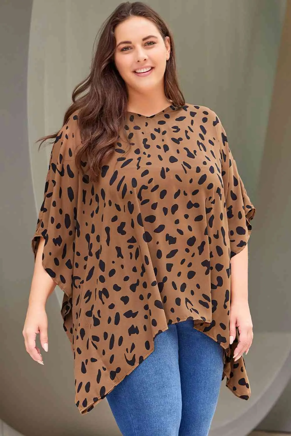 Plus Size Animal Print Handkerchief Hem Blouse sold by The Barefoot Brunette Boutique