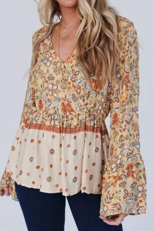 Peplum Printed Surplice Flare Sleeve Blouse sold by The Barefoot Brunette Boutique