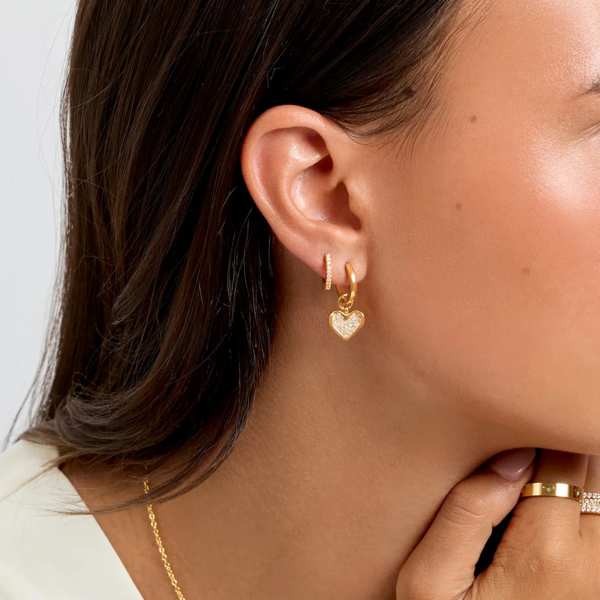 Pavé Heart Huggie Earrings (Gold) sold by Abbott Lyon product image thumbnail 4