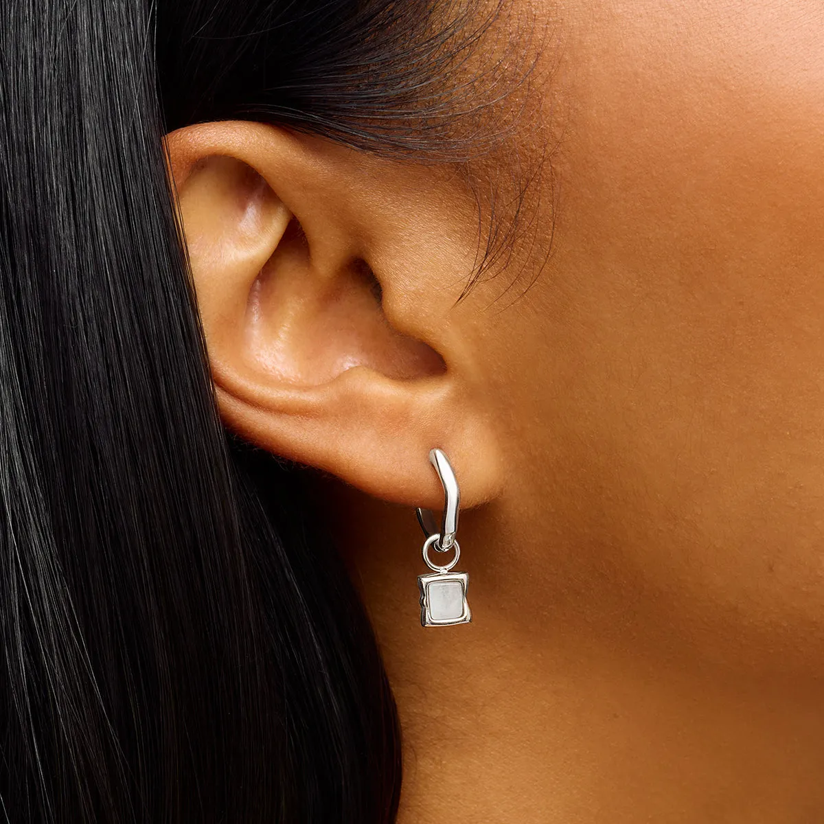 Molten Moonstone Huggie Earrings (Silver) sold by Abbott Lyon product image thumbnail 2