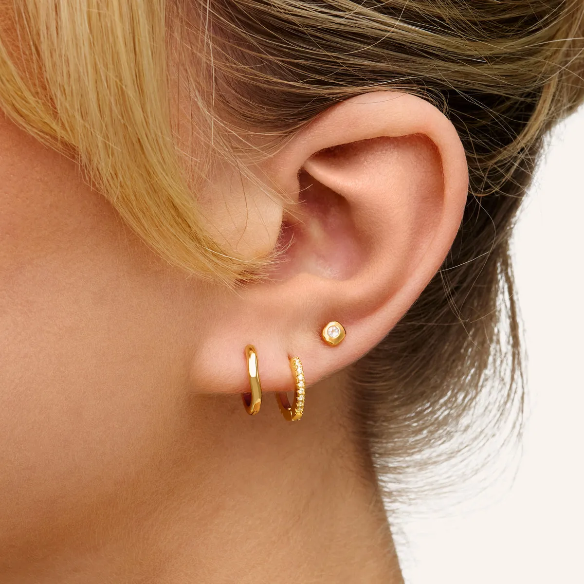 Fine Molten Huggie Earrings (Gold) sold by Abbott Lyon product image thumbnail 3