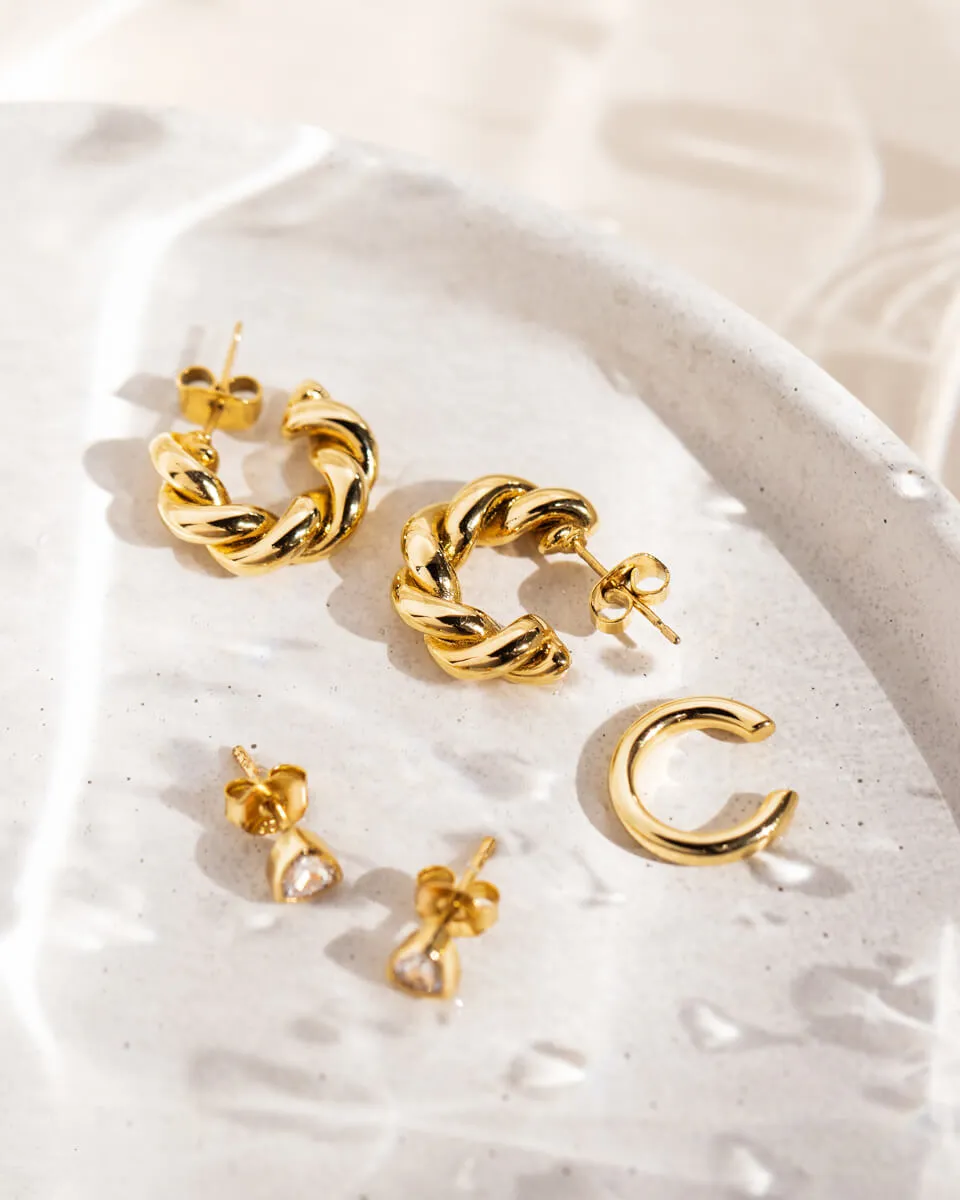 Twisted Huggie Hoop Earrings (Gold) sold by Abbott Lyon product image thumbnail 5