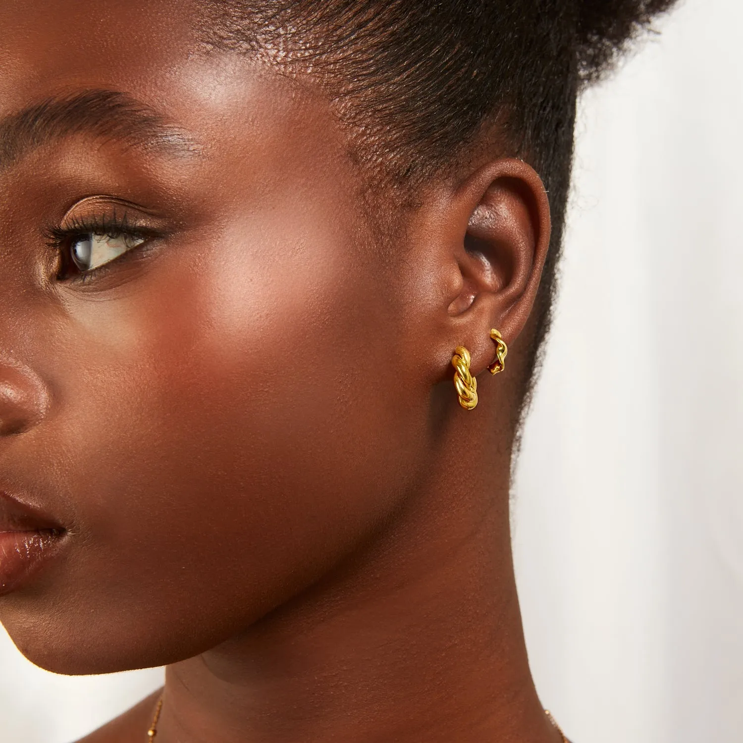 Twisted Huggie Hoop Earrings (Gold) sold by Abbott Lyon product image thumbnail 3
