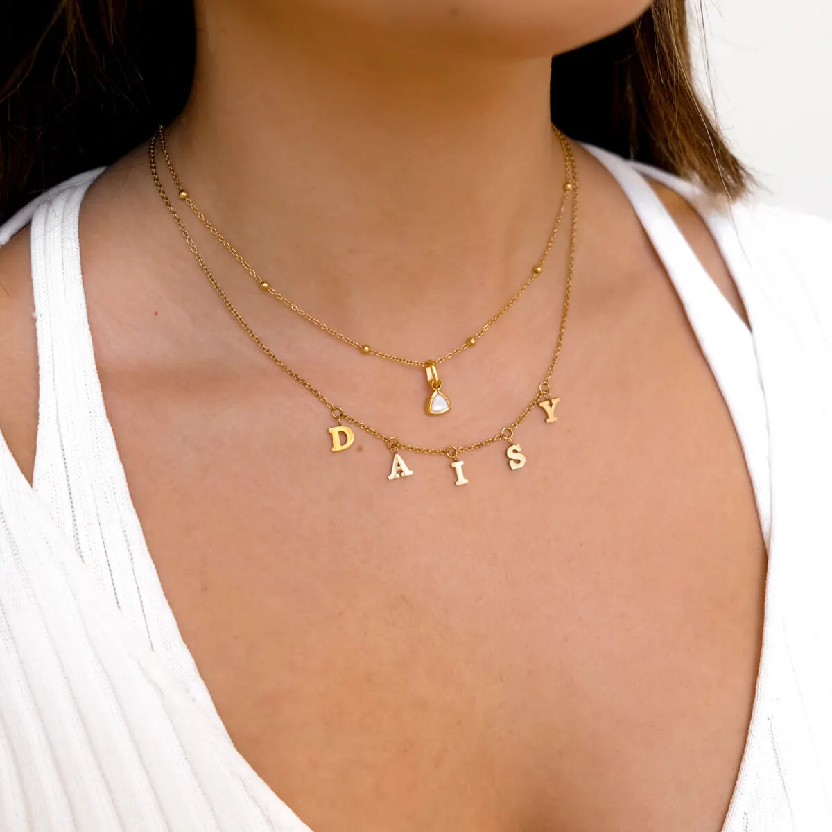 Mini Hanging Letter Name Necklace (Gold) sold by Abbott Lyon product image thumbnail 3