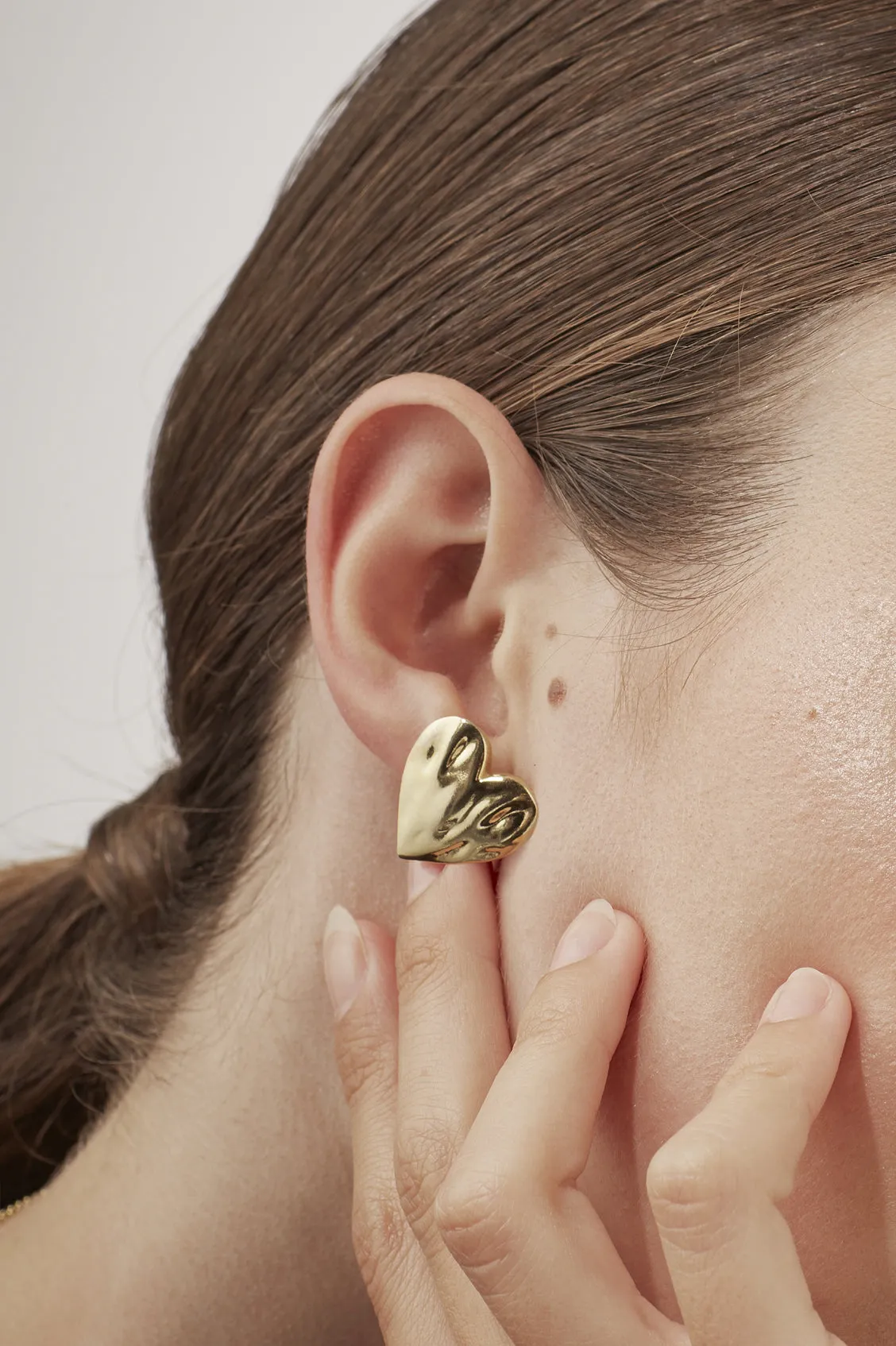 Oversized Molten Heart Stud Earrings sold by Estella Bartlett product image thumbnail 2