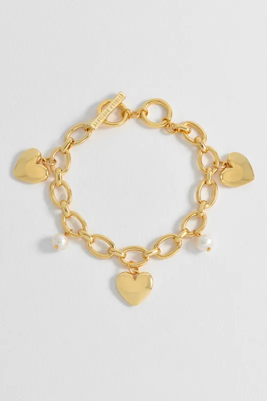 Pearl and Heart Charm Bracelet sold by Estella Bartlett