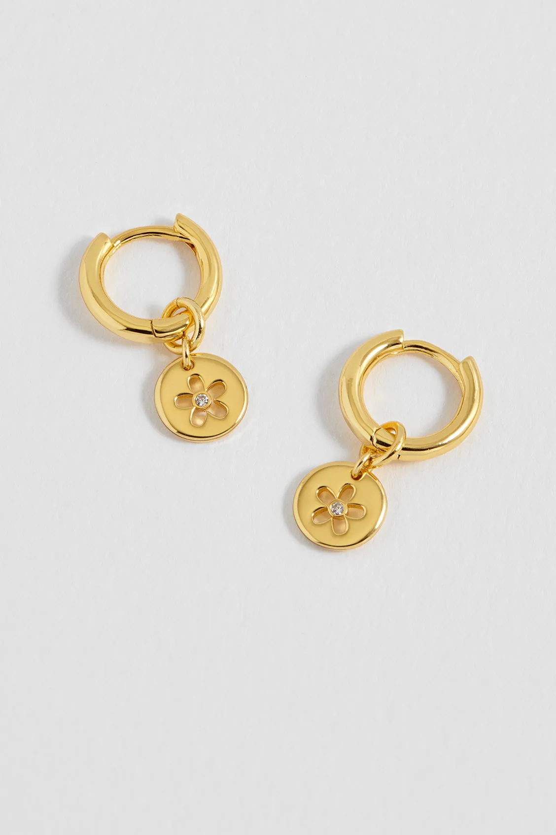 CZ Flower Coin Huggie Hoops sold by Estella Bartlett
