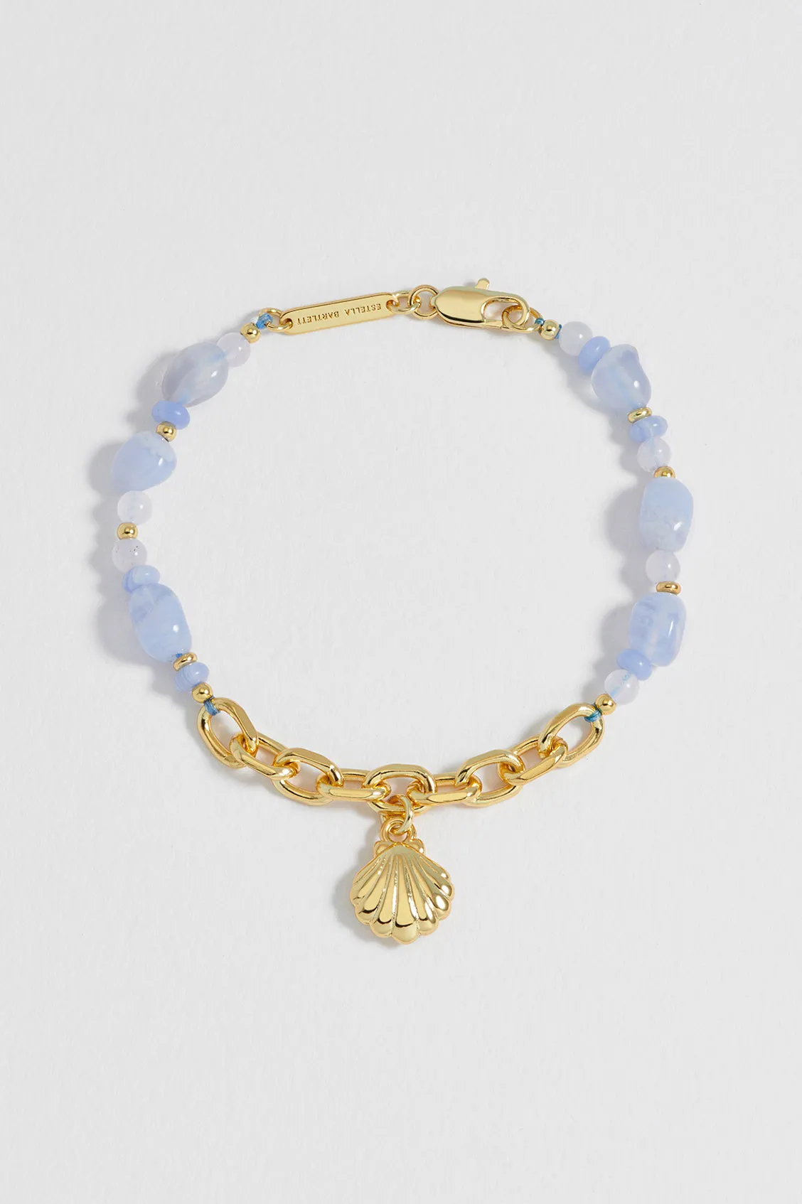 Blue Gemstone Seashell Charm Bracelet sold by Estella Bartlett