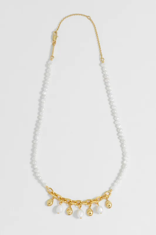 Pearl and Molten Pebble Charm Necklace sold by Estella Bartlett