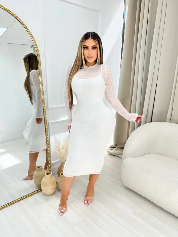 All in the details dress sold by Glamour Fashion
