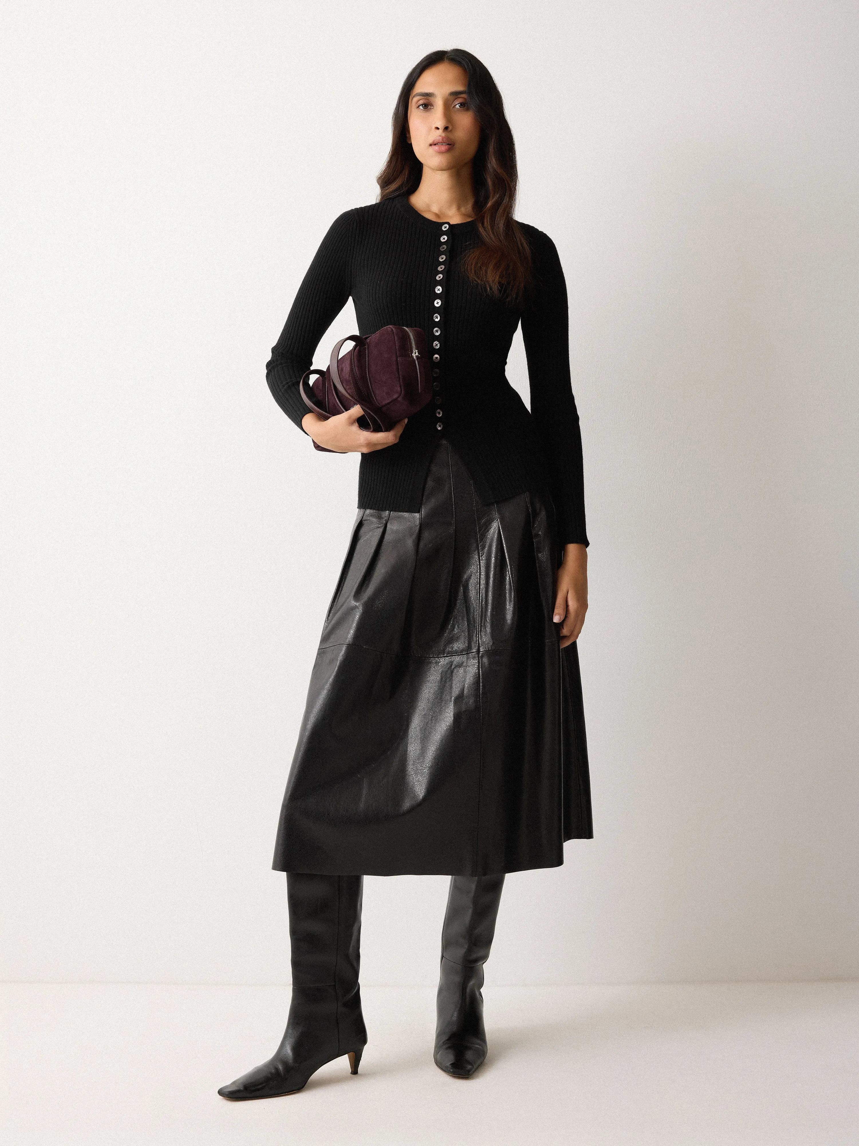 Leather Textured Midi Skirt | Black sold by Jigsaw