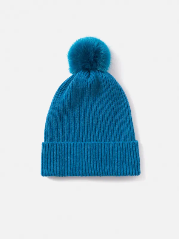 Faux Fur Pom Hat | Blue sold by Jigsaw
