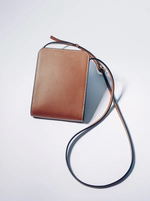 Leather Crossbody Phone Bag | Tan sold by Jigsaw